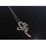 A 9ct white gold pendant encrusted with 35 diamonds in a floral design on a 46cm long white gold