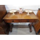 A Victorian two drawer lady's desk and a chair (2)