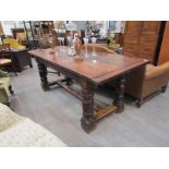 A 19th Century oak and mahogany refectory table with heavy turned base,