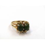 A jade two stone ring with yellow metal shank. Size O, 4.
