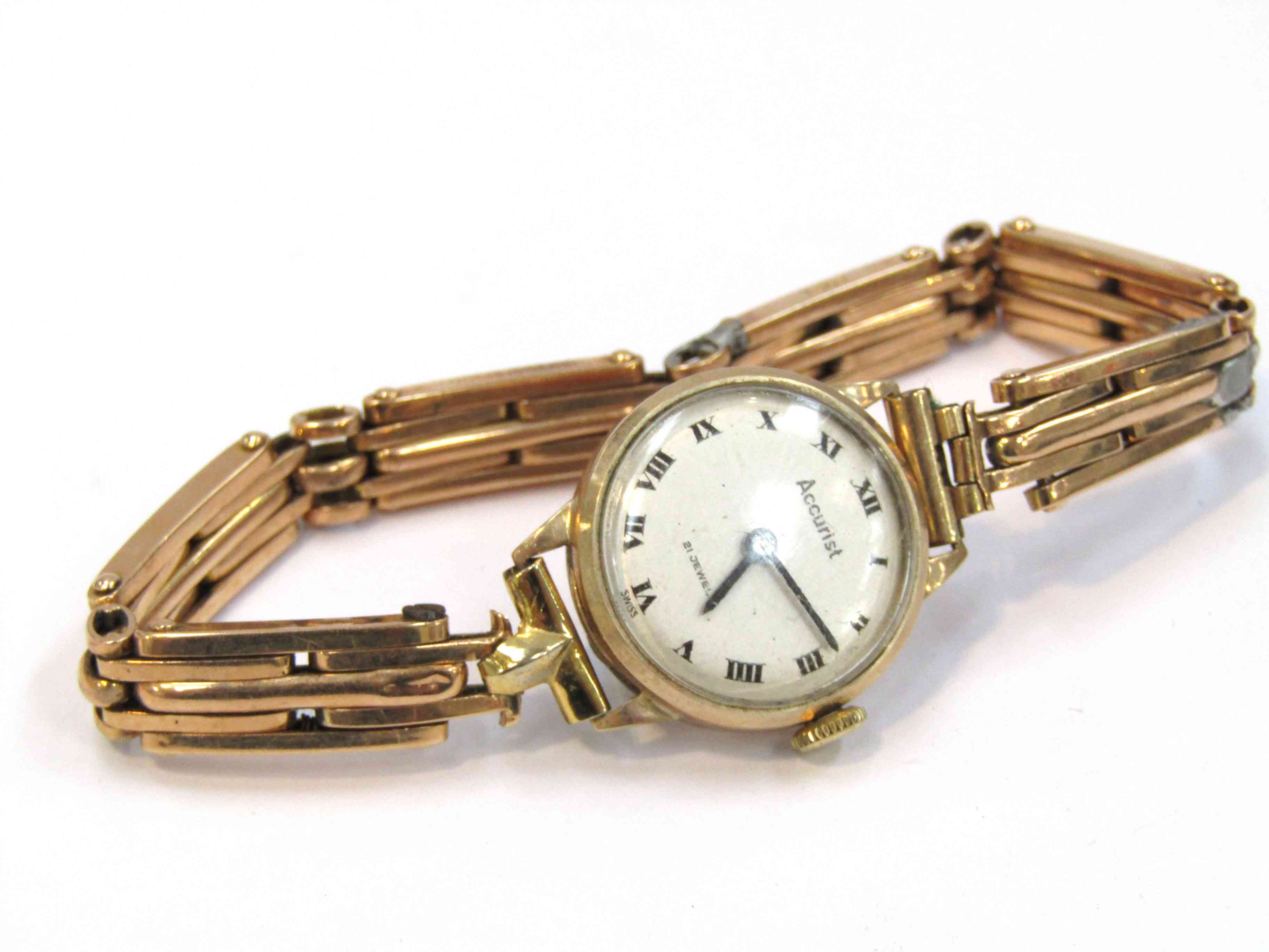 A lady's Accurist 9ct gold cased wristwatch with 15ct gold bracelet, solder repairs to bracelet,