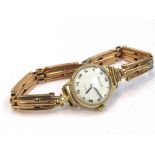 A lady's Accurist 9ct gold cased wristwatch with 15ct gold bracelet, solder repairs to bracelet,