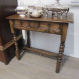 A Titchmarsh & Goodwin 17th Century oak side table with single frieze drawer on turned legs joined
