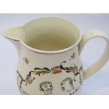 An 18th Century creamware jug "We 3 logerheads be 1783", hairline to spout,