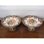 A pair of Royal Crown Derby Imari comports, all-over gilded foliage, 24.