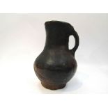 A Medieval pottery jug, reputedly dug up at Salisbury Cathedral with Passmore collection label,