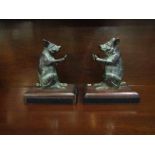 A pair of bronze "pig" bookends