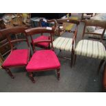 A pair of mahogany bar-back dining chairs and another,