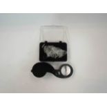 A 40x jeweller's loupe/pocket magnifier with LED light,