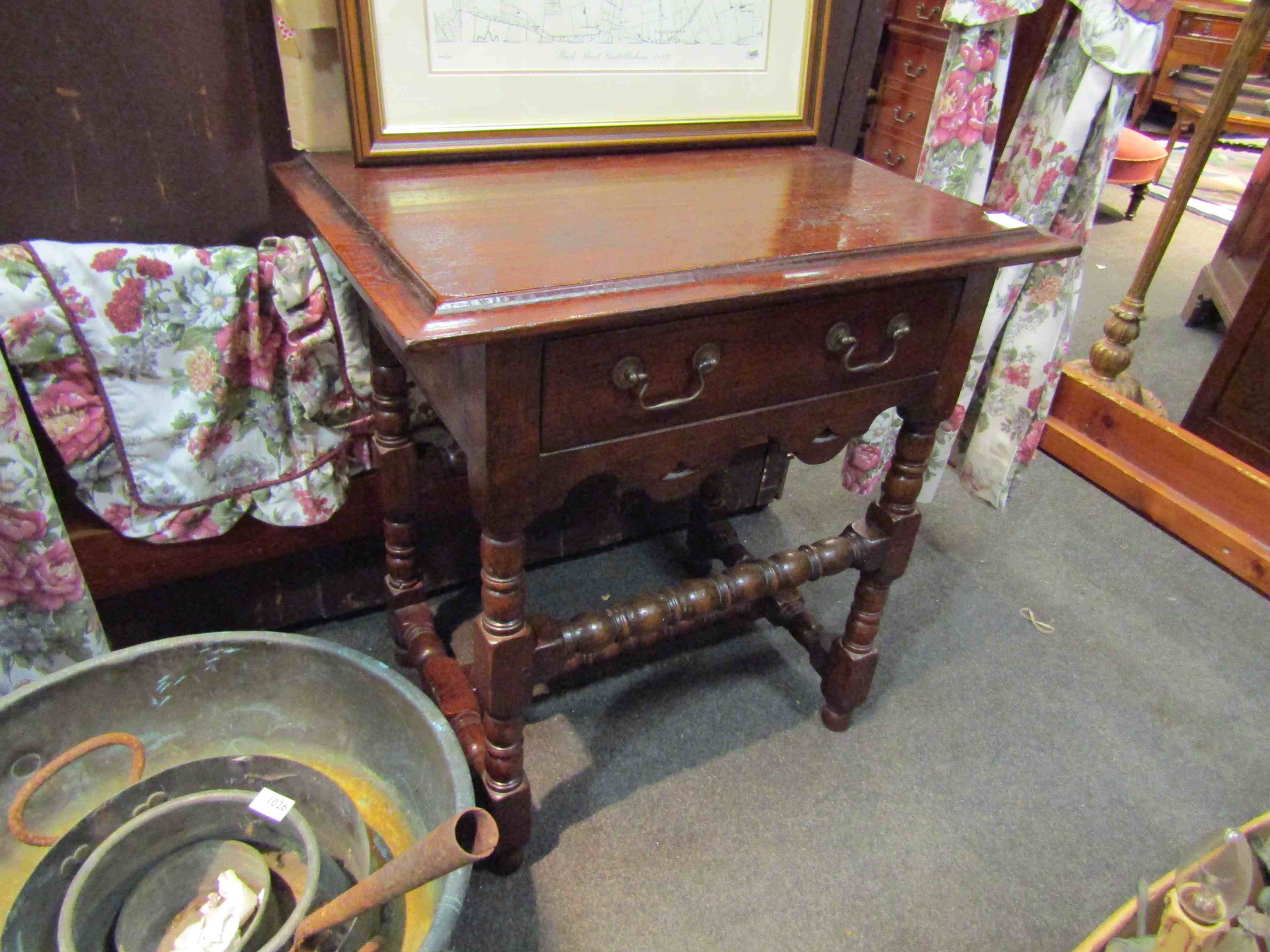 An early 18th Century style side table with single drawer and bobbin turned stretchers,