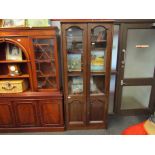 A modern oak effect slim glazed cupboard on two door base,