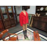 A child's mannequin with red jacket,