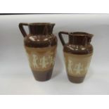 A pair of Royal Doulton Burslem Egyptian pattern jugs,