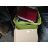 Two boxes containing a quantity of stamps,