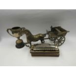 A brass model of a horse and cart,