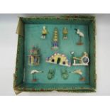 A boxed set of 20th Century Chinese tourism clay figures to include a pagoda, bridge, frogs,