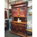 A French oak glazed bookcase on two door,