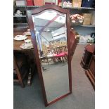 A mahogany framed bevel edged full length mirror,