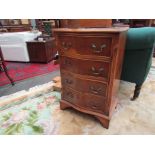 A slim chest of four drawers,