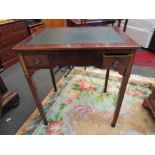 A French fruitwood 19th Century writing desk of two drawers on square tapering brass cap footed