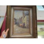 Framed and glazed watercolour depicting figures in a street, signed lower right,
