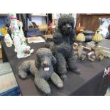Two resin poodle figures