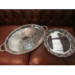 An oval plated twin handled tray and a wavy rim plated tray on cabriole feet