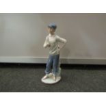 A Nao golfing figure,