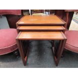 A teak nest of three graduating occasional table in the style of G-Plan,