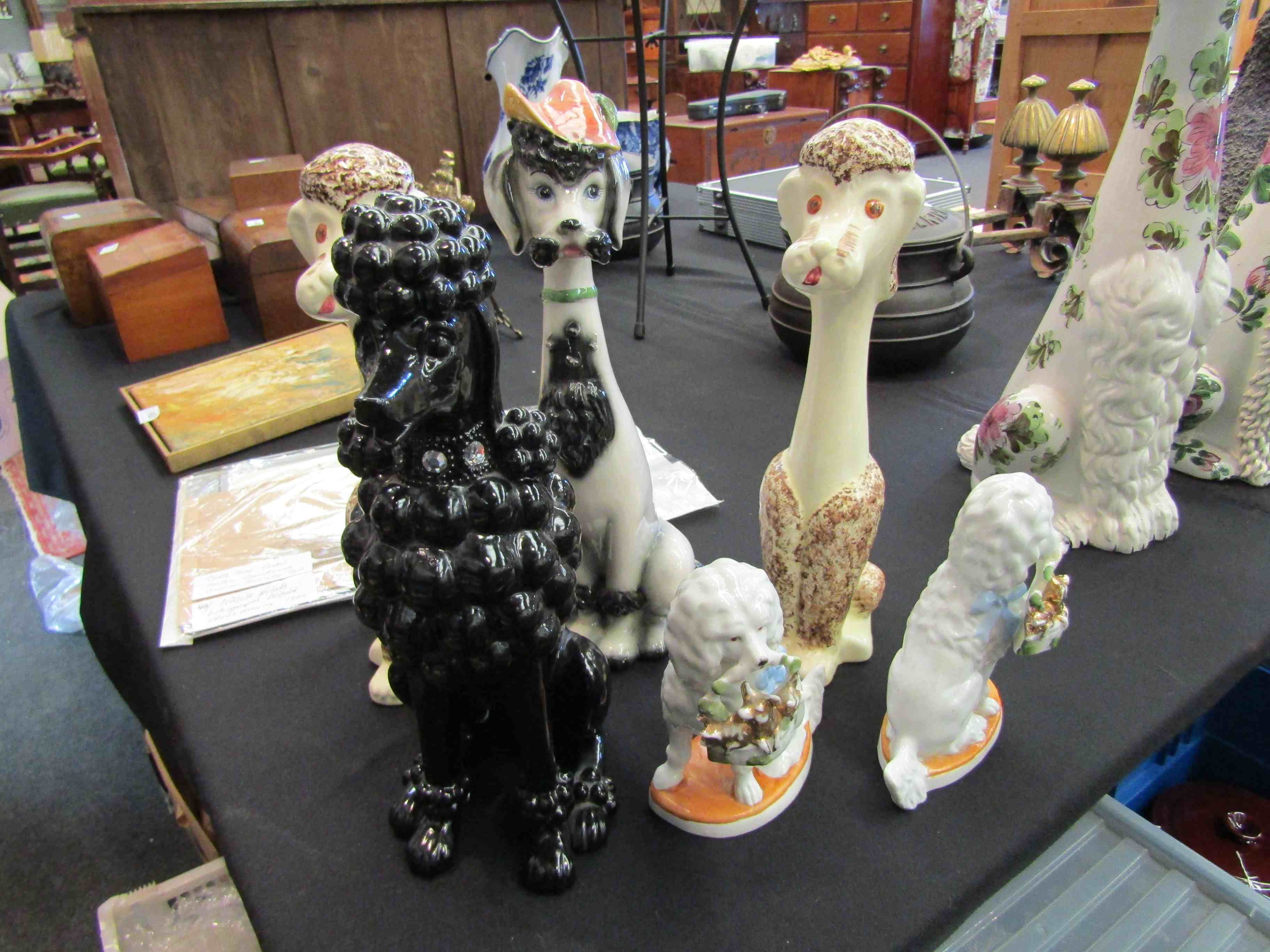 Six ceramic poodle figures