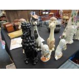 Six ceramic poodle figures