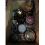 A box containing assorted items including steins