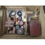 A box containing miniature assorted items including blue glass liners, trophy stands,