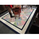 A modern hand knotted geometric rug,