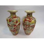 A pair of Oriental vases, one repaired,