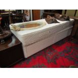 A single divan bed with mattress
