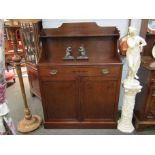 A Regency style mahogany chiffonier with raised shelf back and holly inlaid decoration the single