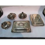 Three silver plated muffin dishes and two plated serving dishes