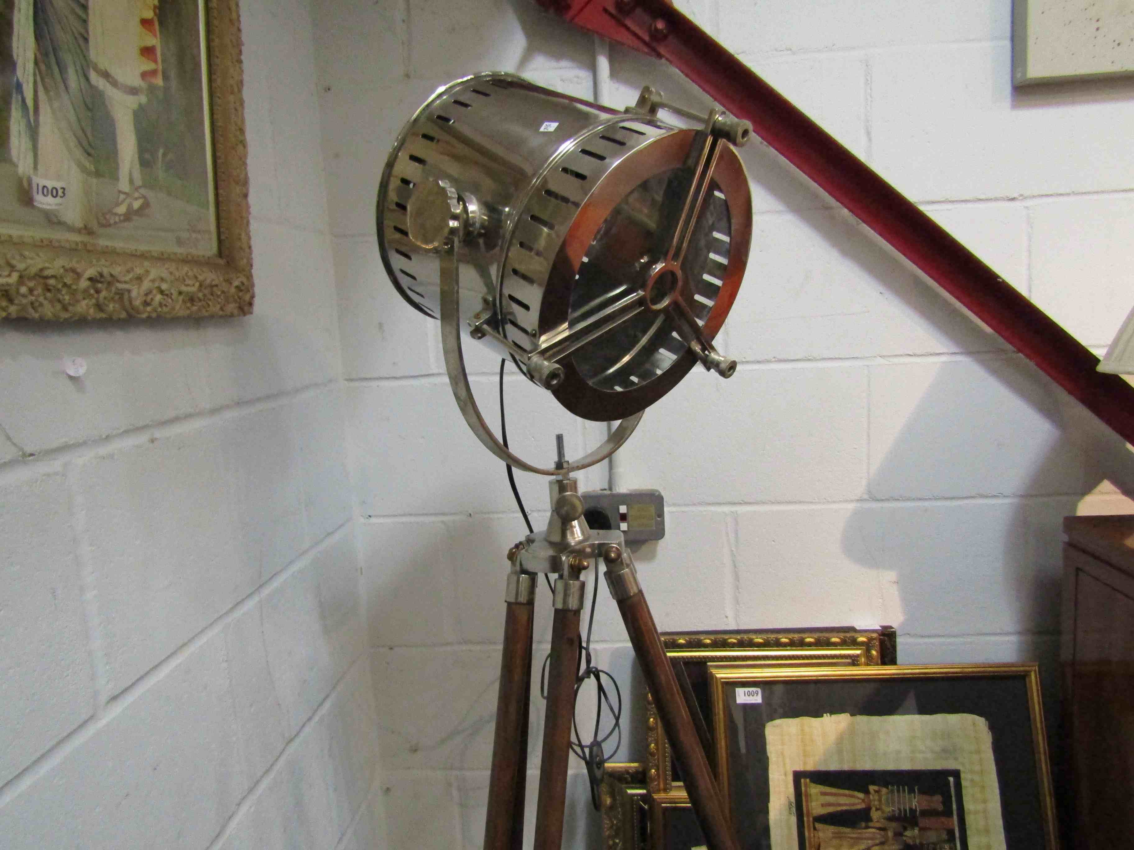 An industrial style standard lamp on tripod base