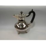 A JSS marked silver plated hot water jug, footed base,