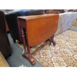 A pale mahogany Sutherland table on ceramic castors,