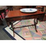A Georgian style satinwood crossbanded mahogany sofa table the serpentine ended rising leaves over