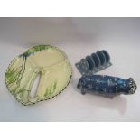 An abstract figure of blue bull and a pottery toast rack,