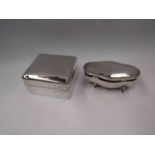 A silver cigarette box (dented) and a silver footed bijouterie box of serpentine form (marks