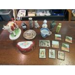 A box containing assorted items including a 19th Century cow creamer, a porcelain patch box,