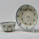 Polychrome teabowl & saucer decorated with cornflower sprigs and blue line border,