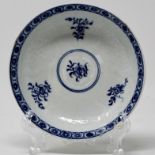 Blue & white moulded saucer painted with flower sprigs, cell border.