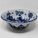 Very rare blue & white basin c1765, the everted rim painted with a scroll and flower border,