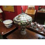 A Tiffany style table lamp with applied butterflies and droplets,