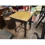 An early 20th Century oak occasional table, turned legs on "H" stretcher base,